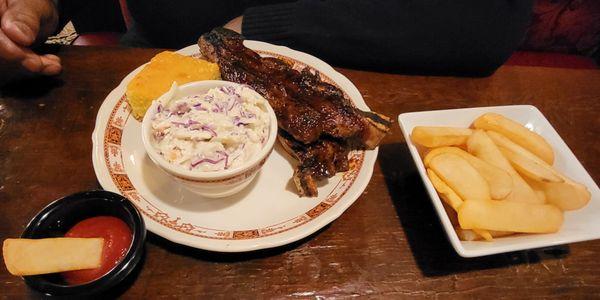 Beef ribs, cornbread, cole slaw, and steak fries.