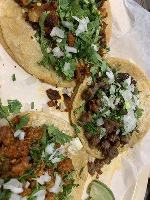 Steak, pork, and carnitas tacos