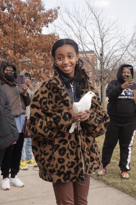 Releasing a dove in memory of his grandmother