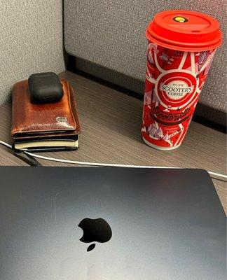 Traveling mans ESSENTIALS! Mac, AirPods, passport and SCOOTER'S amazing coffee!