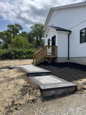 New walkway with pavers and steps.