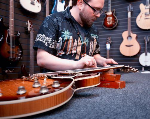 We offer guitar tune ups, re-strings, and much more.