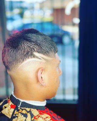 Mid bald fade with small design