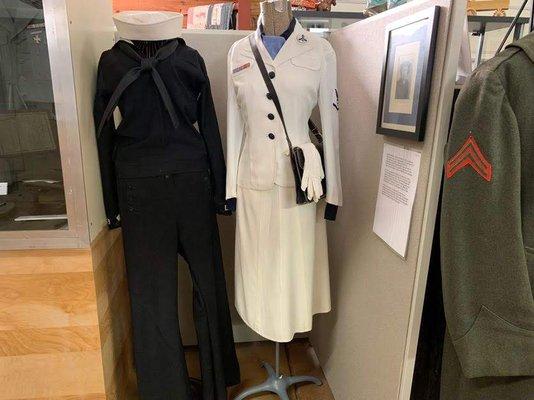 Left - Man's sailor suit WW2  Right - Woman's dress uniform WW2