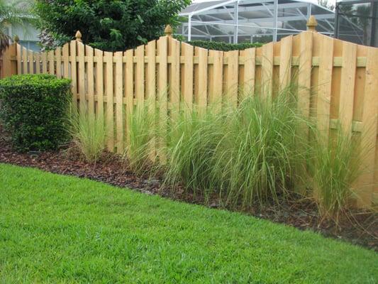 Custom, decorative wood privacy fence by Mossy Oak Fence