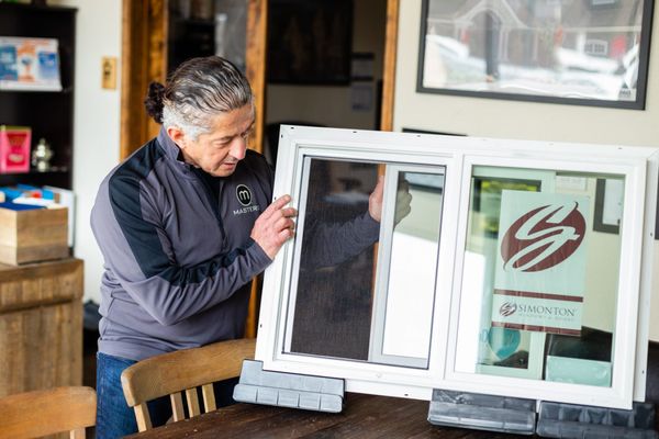 Chuck going over the features of our Simonton windows in the show room.