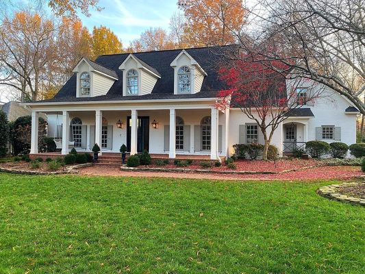 Painted brick exterior of home in Providence Country Club.