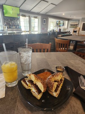 Sausage breakfast sandwich with a juice