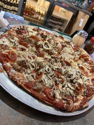 Large Thin Crust pizza with Pepperoni, Mushrooms, Onions. and half Italian Sausage