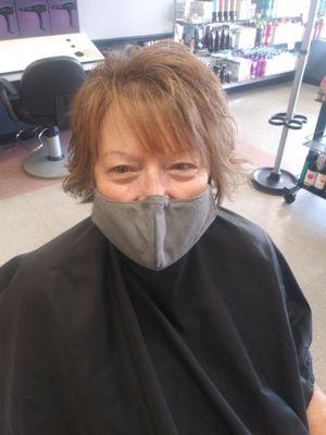 Happy long time client with her new cut and style done by Elisha.