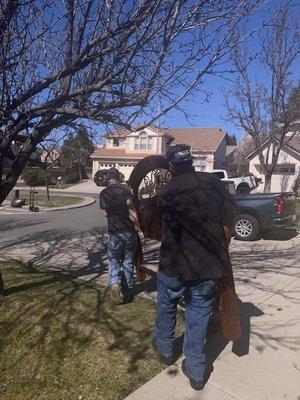 Moving headboard of bed to trailer load. -Fawzi,Alan. Antioch,CA