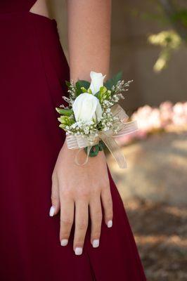 Wristlet corsage. Two mini roses.