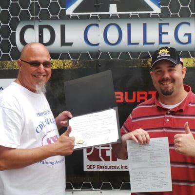 Ted Skinner from Halliburton receives his graduation certificate from Mike White with CDL College.