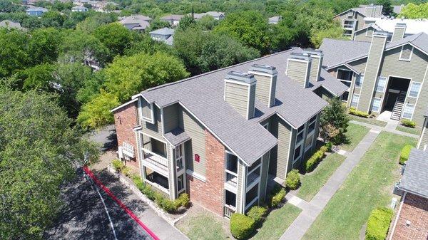 We installed IKO Cambridge IR shingles in Weatherwood on this apartment building.