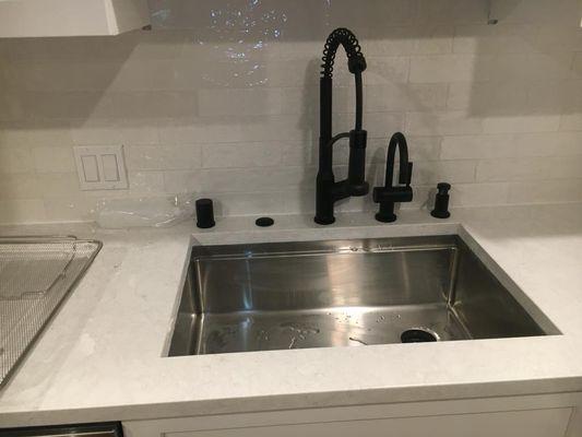 Kitchen sink and faucets installed