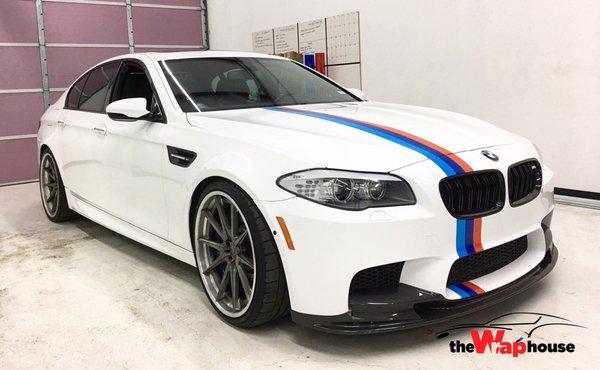 Wrapped in gloss white with M-colored stripes.