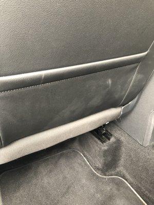 Back of drivers seat, footprints.