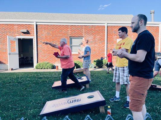 People in the cornhole tournament