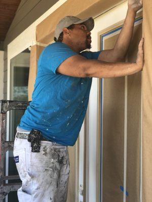 This is Jovan doing some detailed masking on some doors that we are getting ready to paint in Spokane, Wa