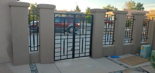 Adobe and iron security gate.