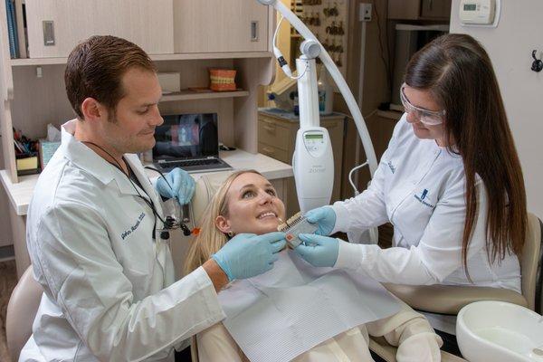 Dr.John & assistant, Isabella, shading a patient before Zoom Whitening!