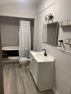 Renovated bathroom with fresh glazed cast iron tub.