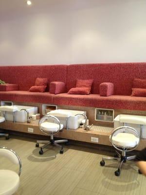 Pink Pedicure Lounge--one long couch w/cushions & pedicure sinks.