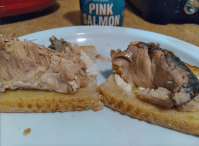 Pink Salmon on buttered toast served with Chalula Sauce.