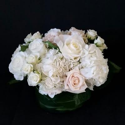 Arrangement of hydrangea  and roses.