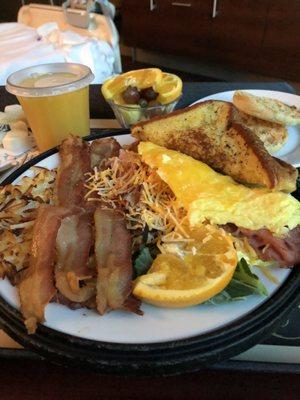 Amazing breakfast! Ham and cheese omelette, bacon, hashbrowns, English muffin, French toast and fresh fruit! Yum!