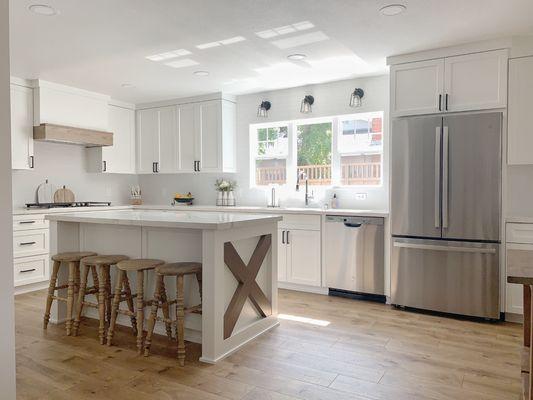 White shaker kitchen cabinets with island.