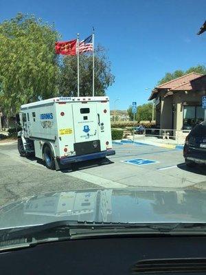 Brinks blocking ALL handicap parking....