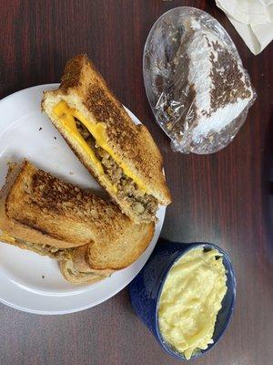 Hot Meatloaf sandwich with cheese on homemade bread, potato salad, chocolate cream pie