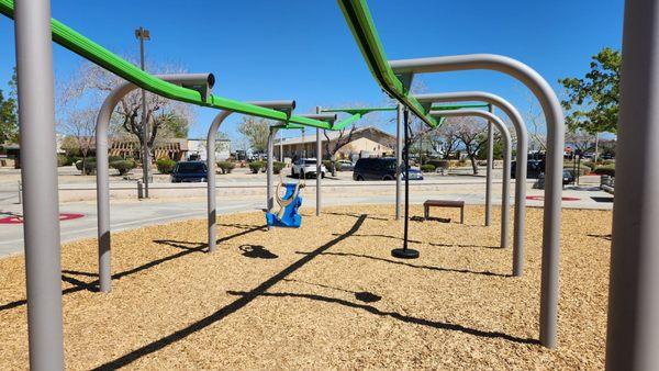 These swings slide along the tracks!