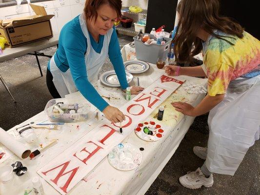 We offer art classes in our Art Underground. Artist Amy Ballard is teaching how to create welcome signs.