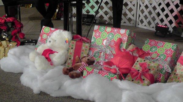 Some Beautiful Christmas Presents Wrapped Under The Piano.