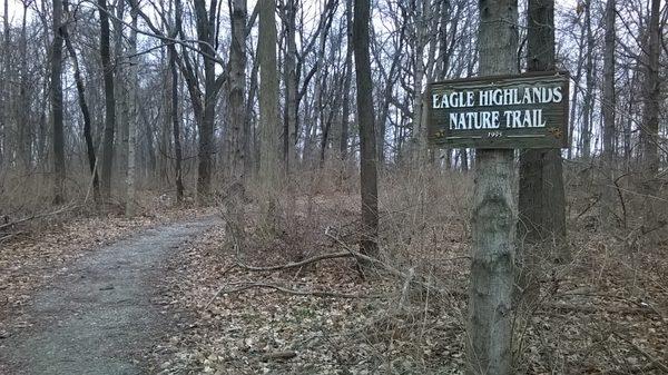 West end of the nature trail that goes about 0.4 miles to the playground & shelter area