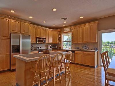 Meal times are a pleasure when sitting in this bright open kitchen.