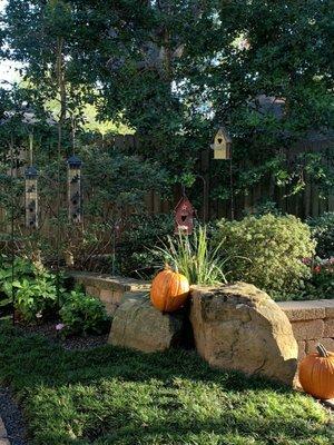 Two of Burt's birdhouses next to our bird feeders.