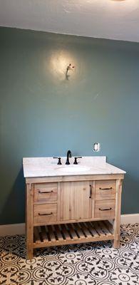 Bathroom vanity install before mirror installation. All floor tile was installed as well.