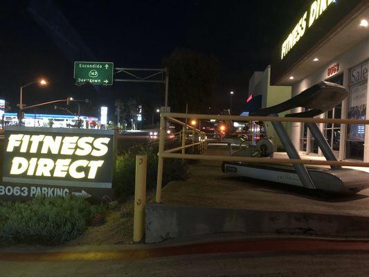 Fitness Direct storefront glows at night!