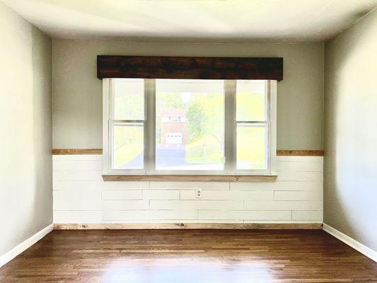 Custom shiplap wainscoting for living room as well as a custom wooden valance