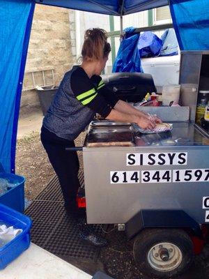 Hot handheld food with a cold refreshment.