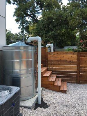 Two rain tanks at a duplex in East Austin.