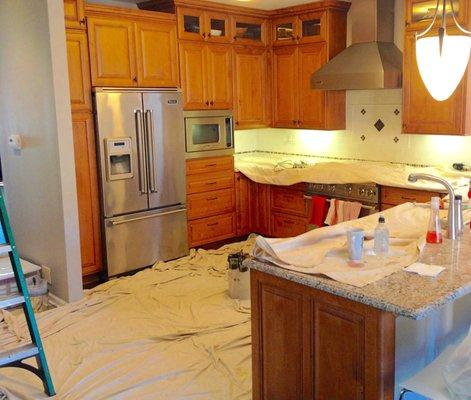 Before photo - Cabinets in need of refinishing