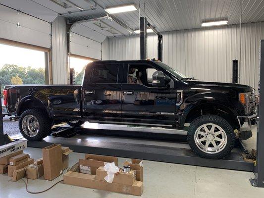 Ford F-350 that received wheels, tires, and leveling kit.