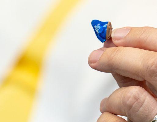 Our really tiny custom, invisible hearing aids.