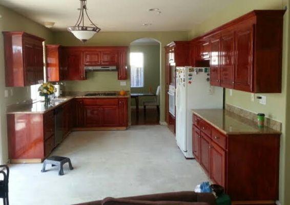 Applied stain to renovated kitchen cabinets.