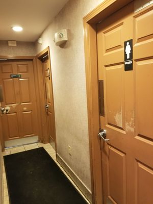 Restrooms down hall near entrance.