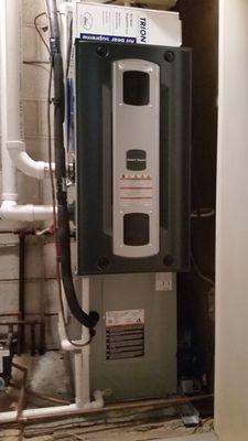 A new 96% efficient furnace, air cleaner, whole house humidifier and air conditioner installed in a closet.